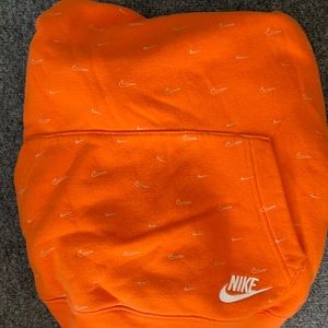 Orange nike hoodie w small logos all over size L
